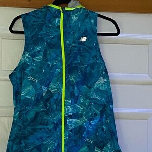 New Balance hooded running vest with two zippered pockets